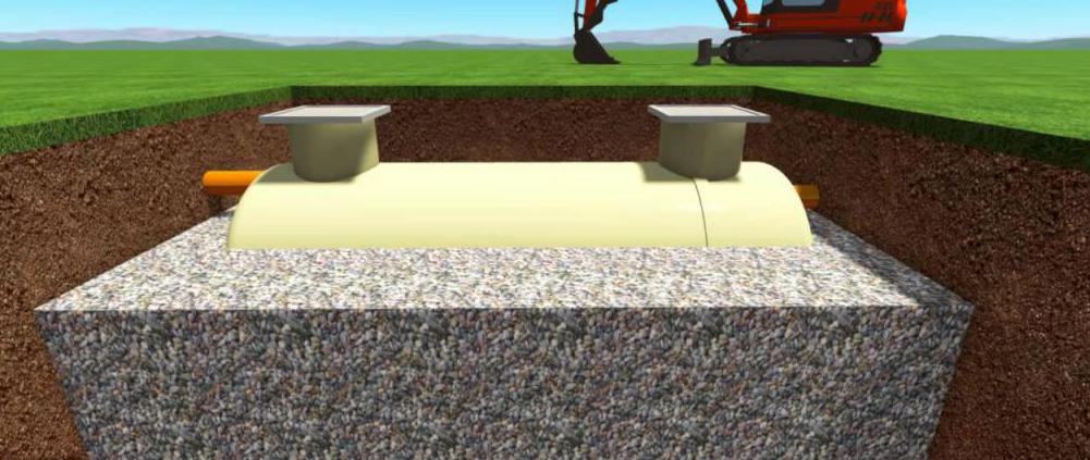 fosse septique faite d'anneaux de béton à distance de la maison